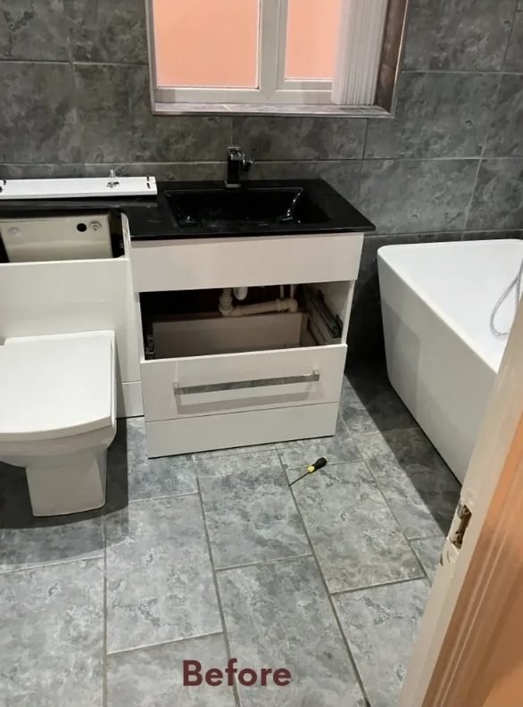 Bathroom before refit, vanity unit part removed during strip-out